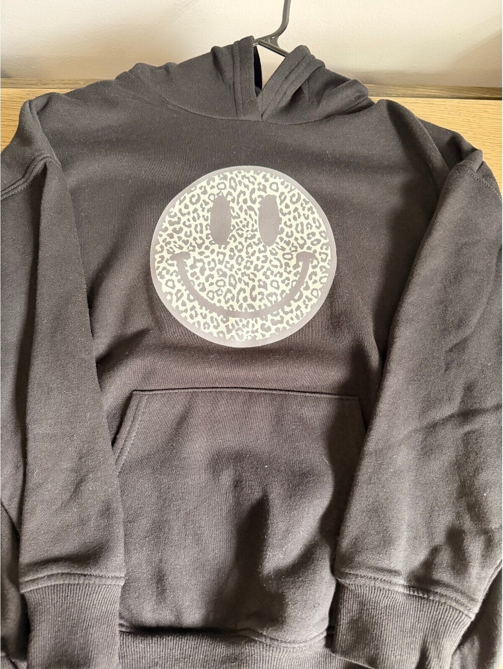 Black Hoodie with Leopard Print Smiley Face Graphic